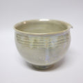 Ceramic bowl with textured surface on a white background